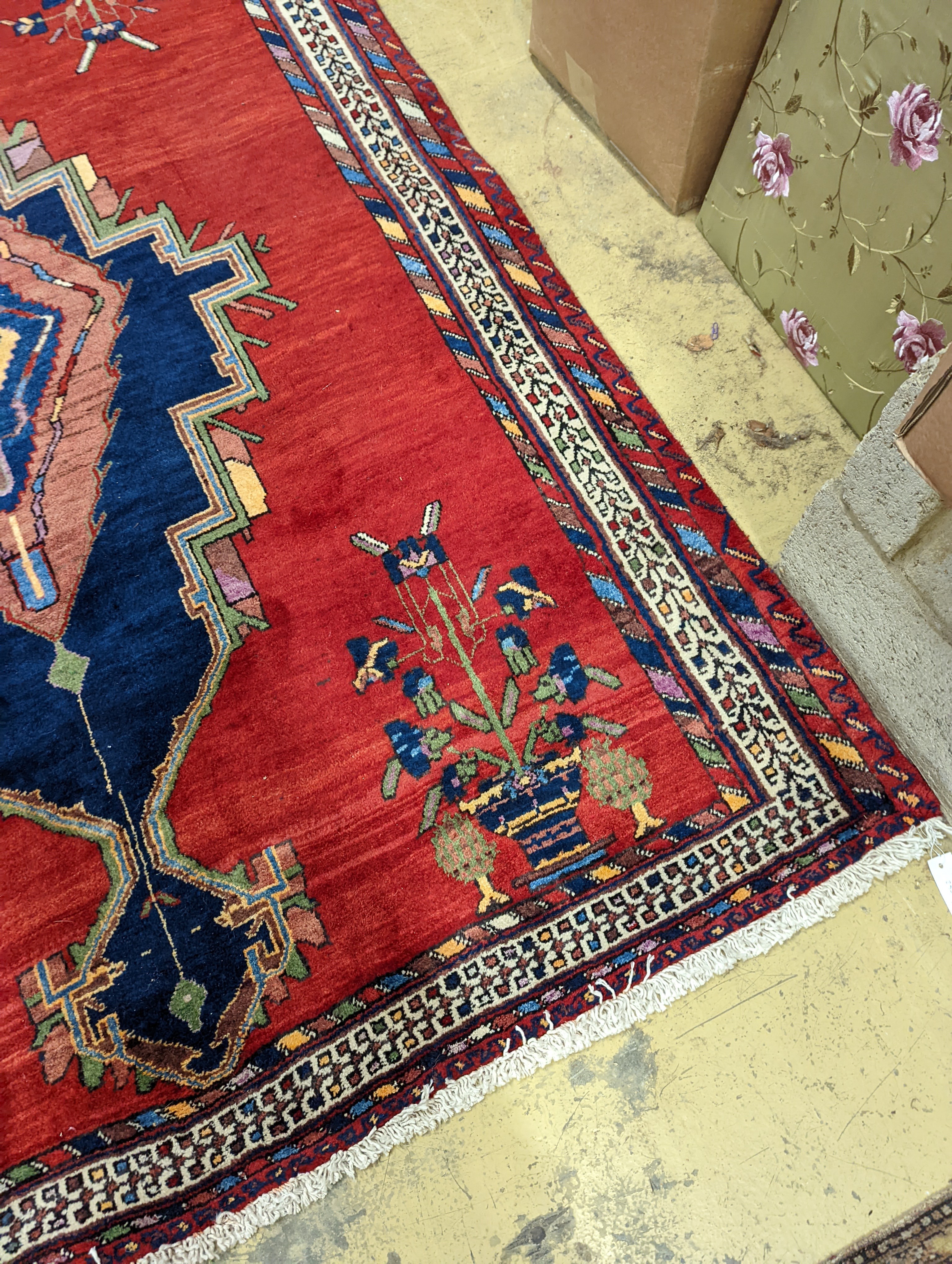 A Caucasian red ground rug, 240 x 168cm